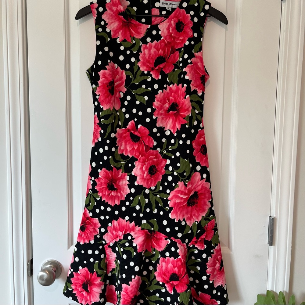 Black dress with hot pink flowers and white polka dots. Size 6.